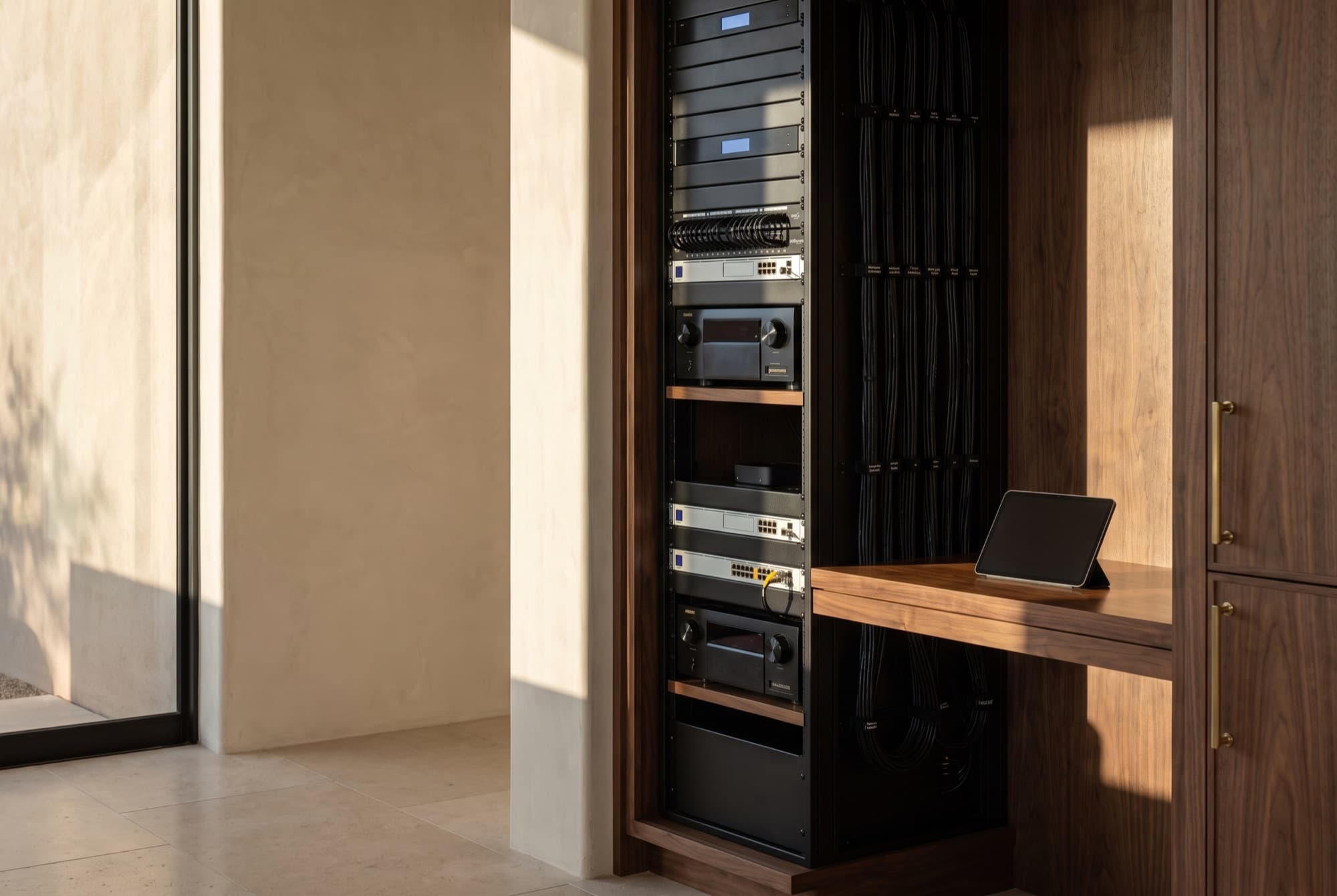 A documented rack in its millwork, labelled and looked after, the kind of system Concierge watches over