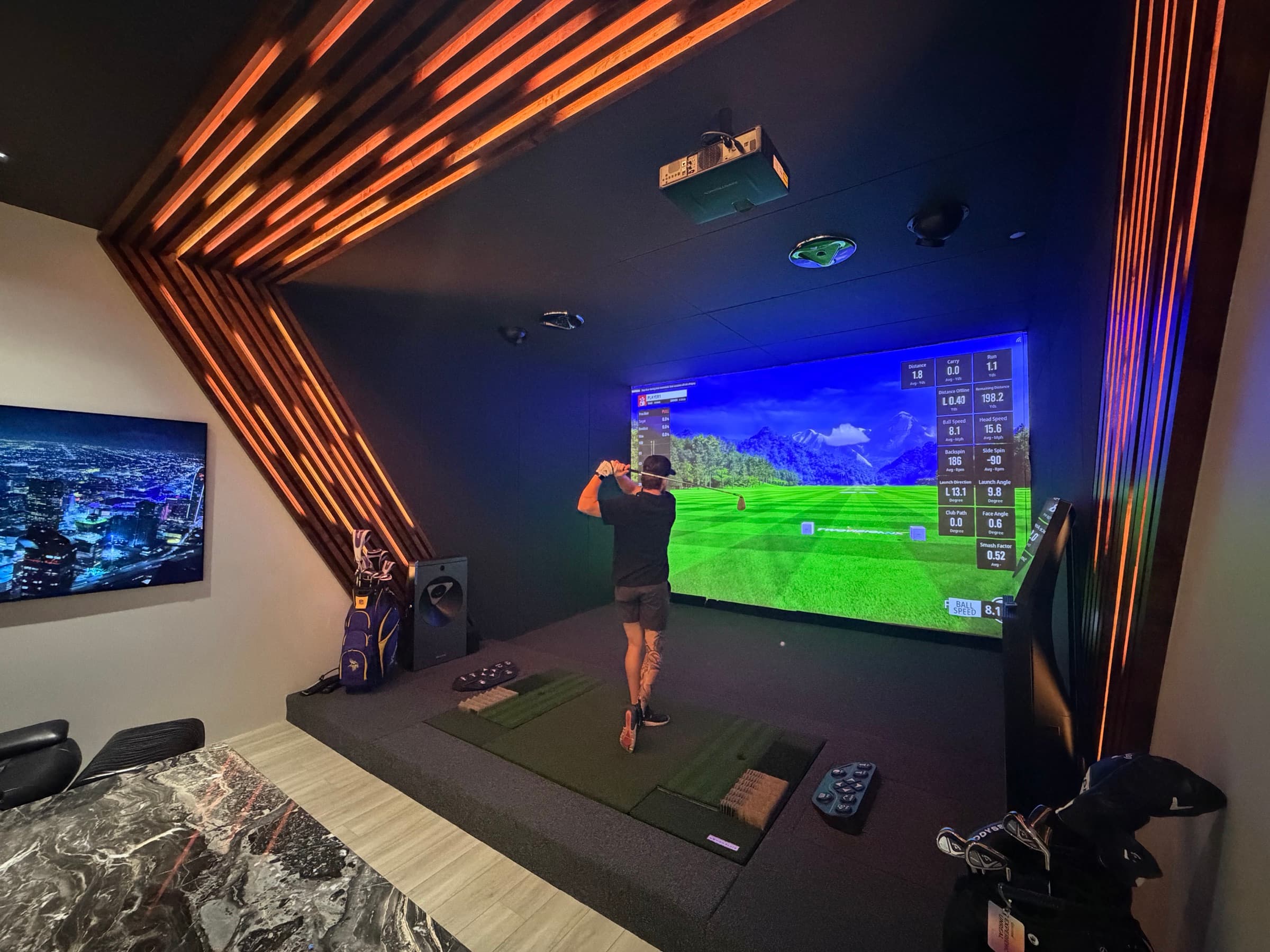 A guest mid swing on the simulator