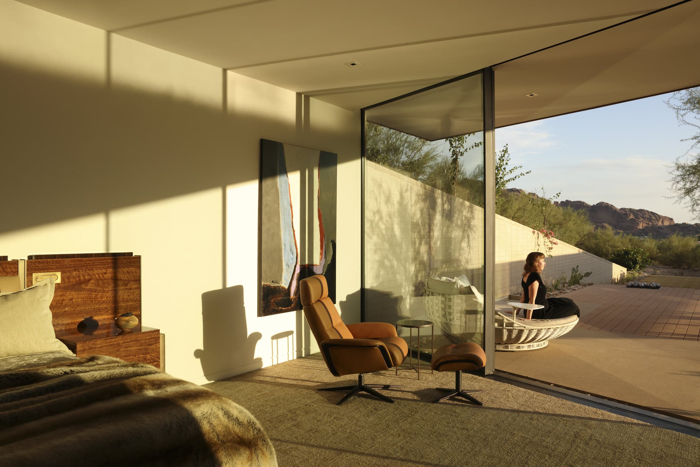 The primary bedroom opening onto the desert patio