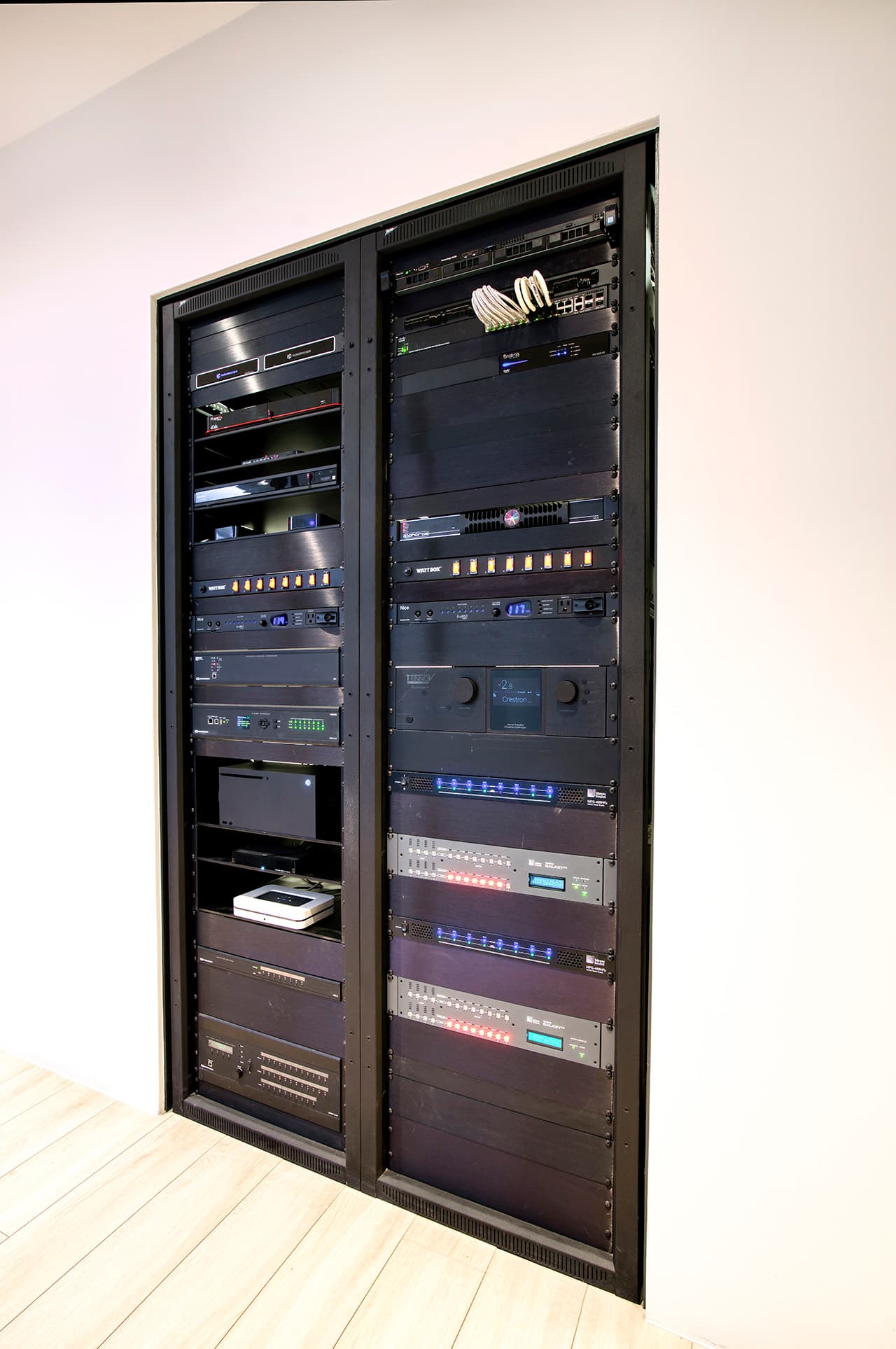 The rear of an equipment rack showing cable management
