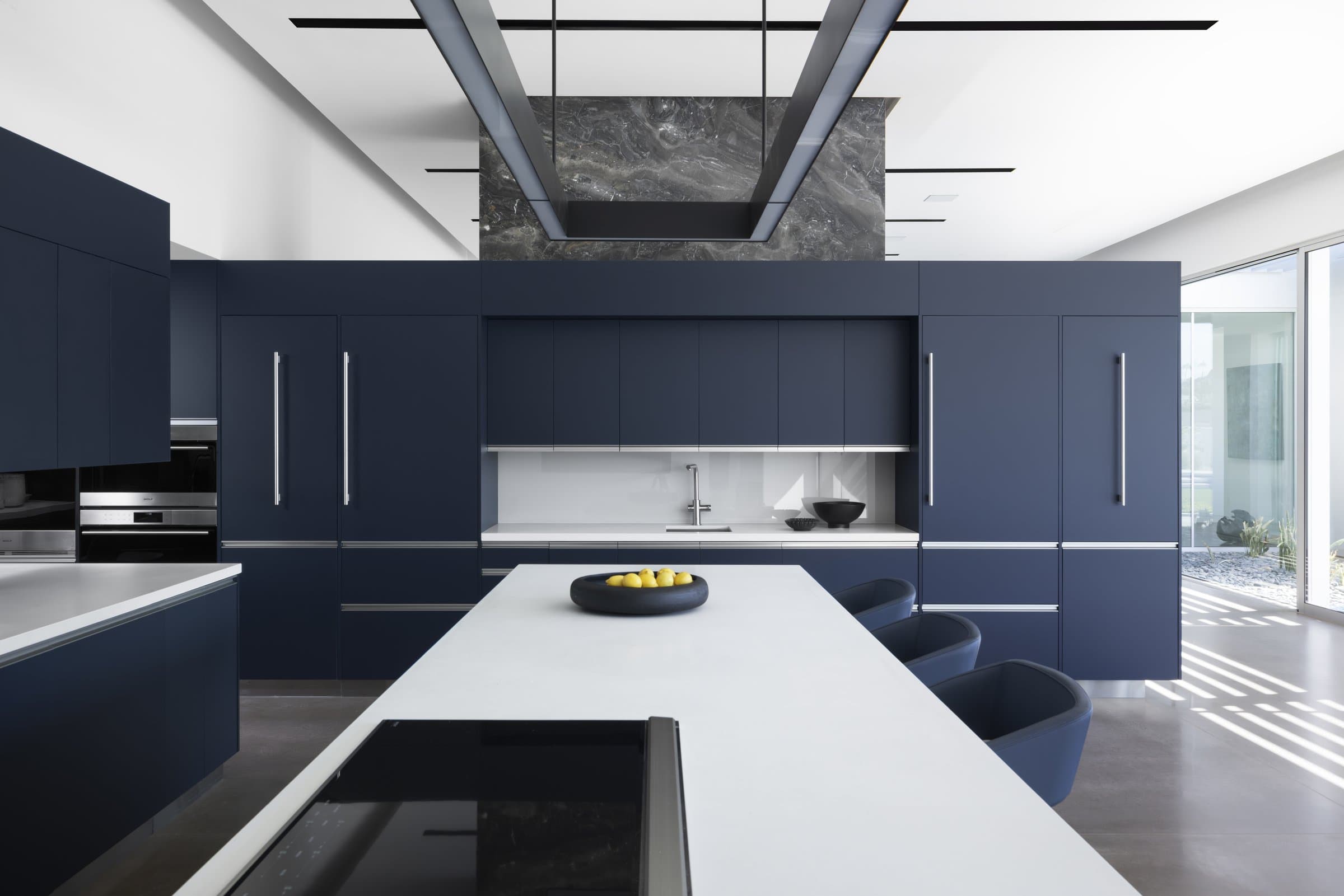 The kitchen island under the folded ceiling