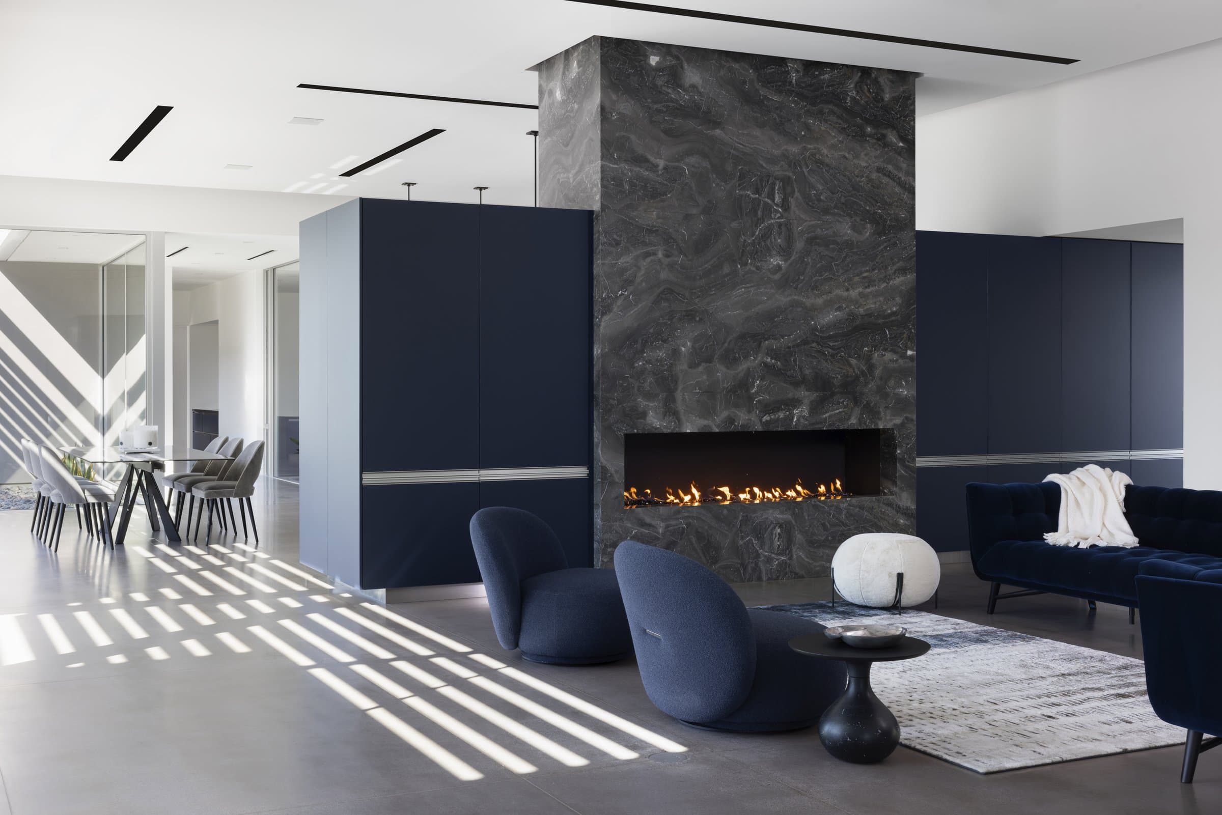 The living room, fireplace set into stone