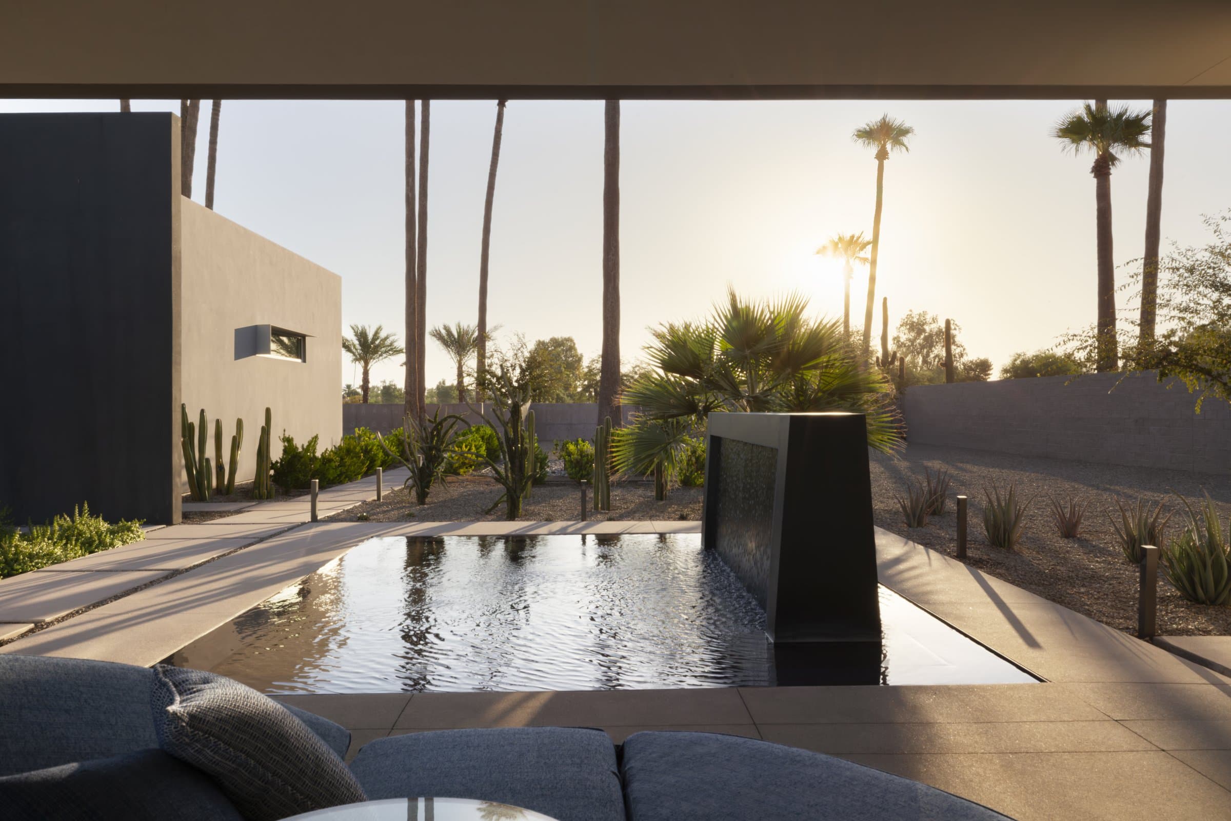 The reflecting pool at sunset, palms along the far wall