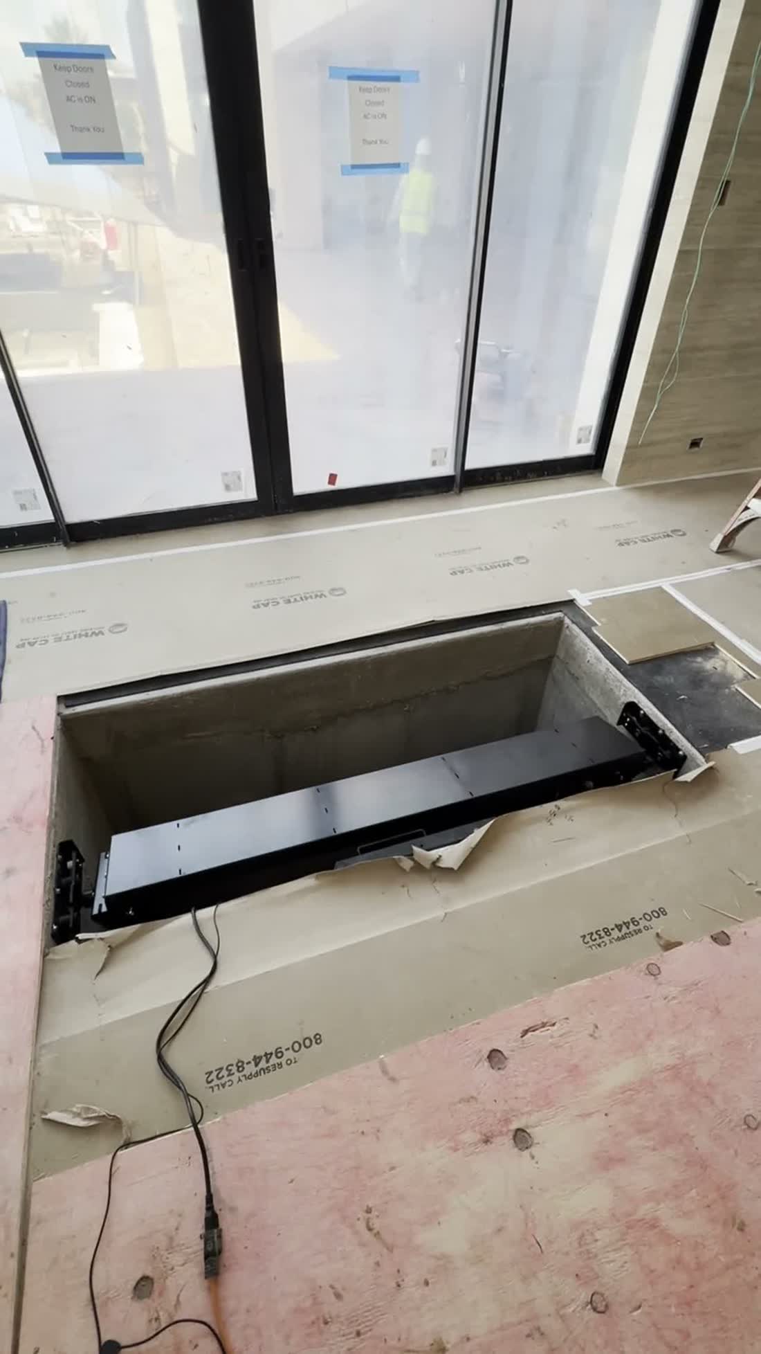 The crew working in the framed floor cavity
