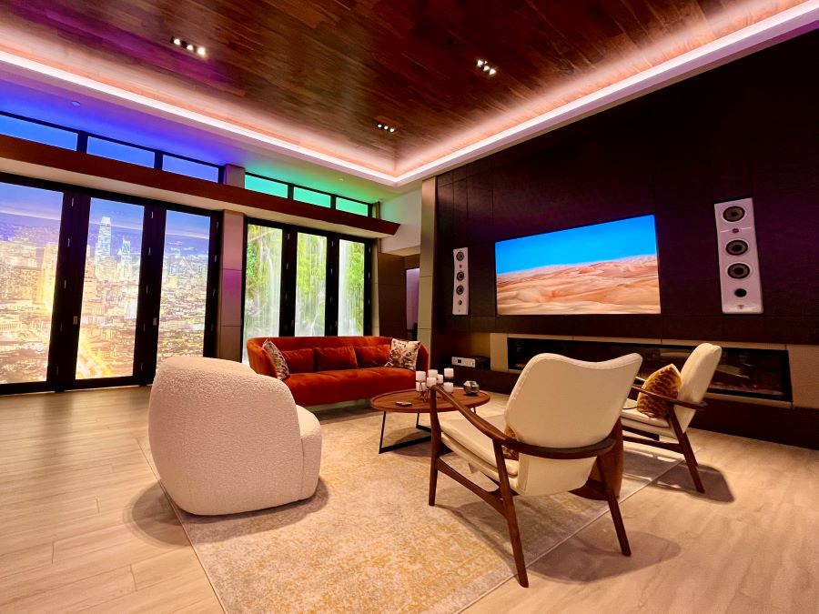 Acoustic Designs Group showroom featuring a sitting area with LED lighting and a flat-screen TV.