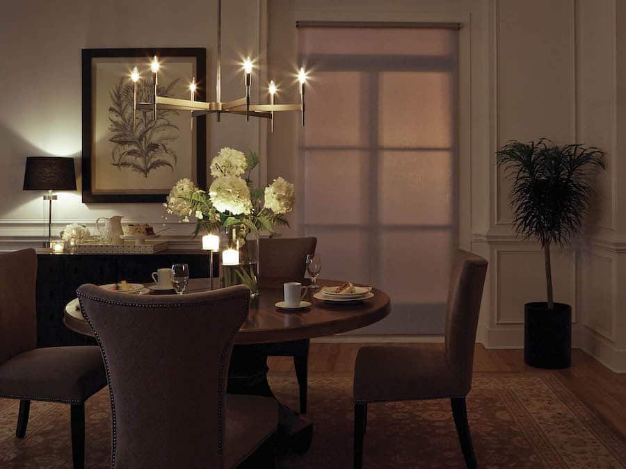 An elegantly lit dining room with a Lutron lighting system.